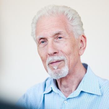 Honoring Harvey Burns Harvey Burns smiling, portrait photo.