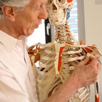 Honoring Harvey Burns Harvey Burns in class demonstrating a Rolfing technique to students