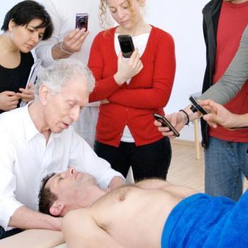Honoring Harvey Burns Harvey Burns in class demonstrating a Rolfing technique to students